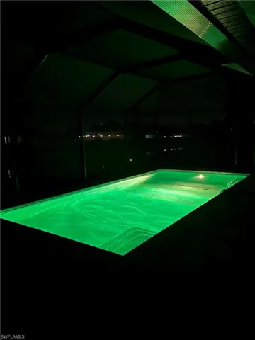 View of swimming pool at night