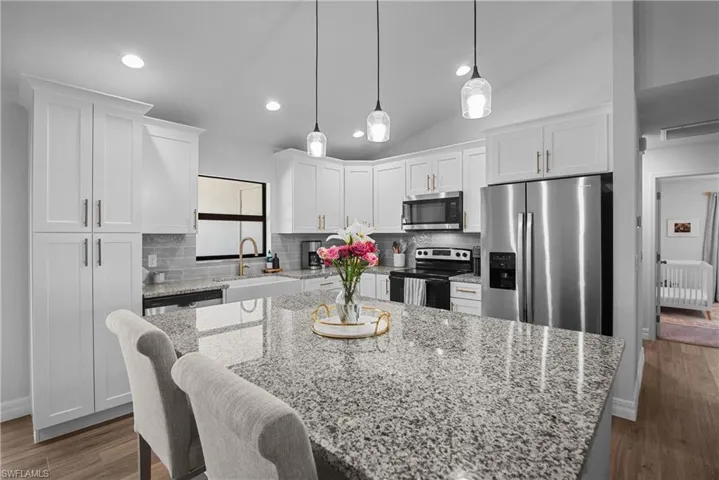 oversized island and stainless steel appliances