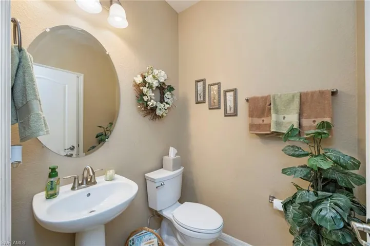 Half bath with a textured wall