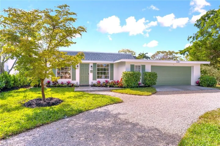View of front facade featuring circular driveway