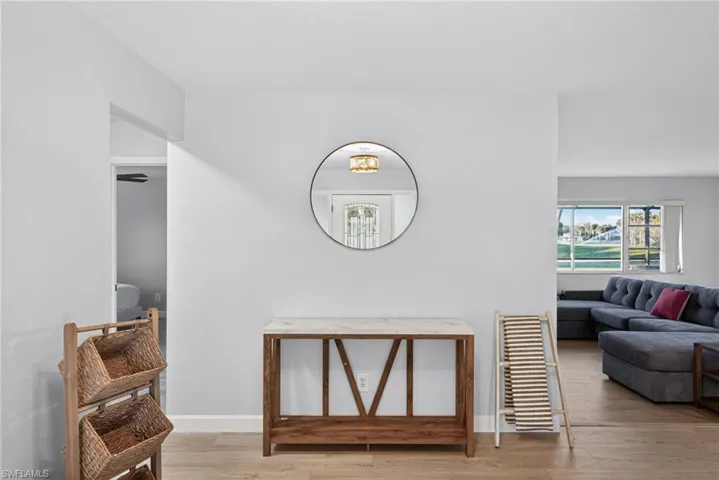 Wood-finish flooring paired with light-toned walls