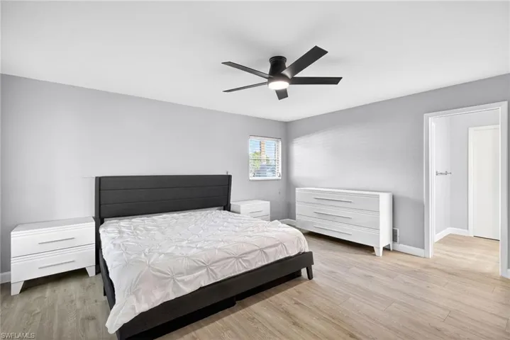 Bedroom featuring light wood-finish flooring and neutral gray walls
