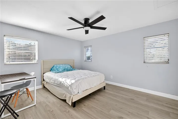 Neutral gray walls complement light wood-finish flooring