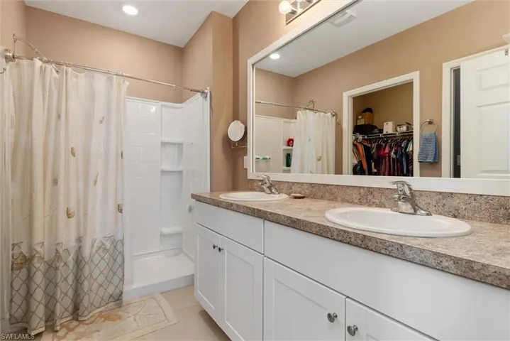 Primary Bath features a shower only, toliet closet and walk in closet