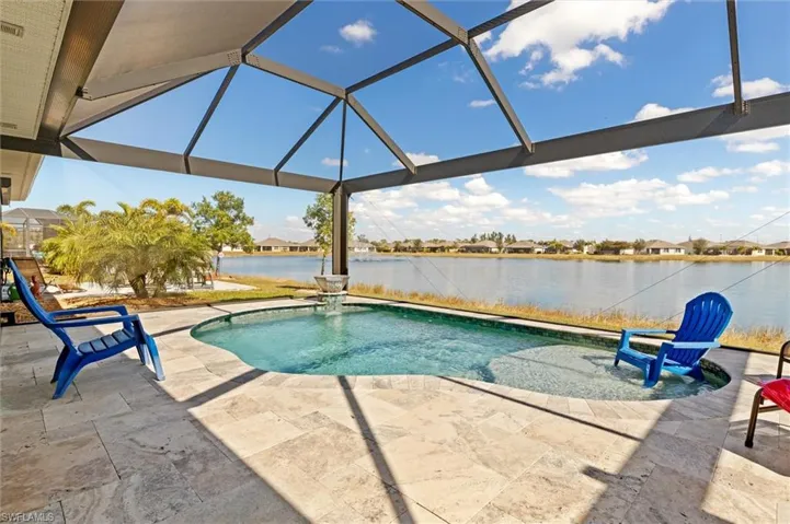 Salt water, sun shelf, heater, water feature, lights. Travertine tile pool deck