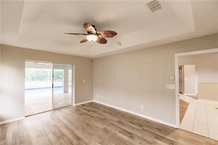 Primary Bedroom with slider to pool area