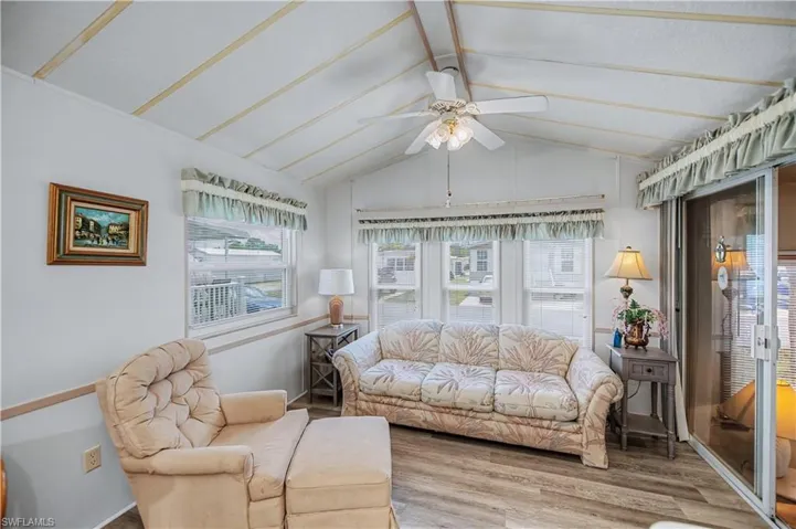 Sunroom / solarium featuring beamed ceiling