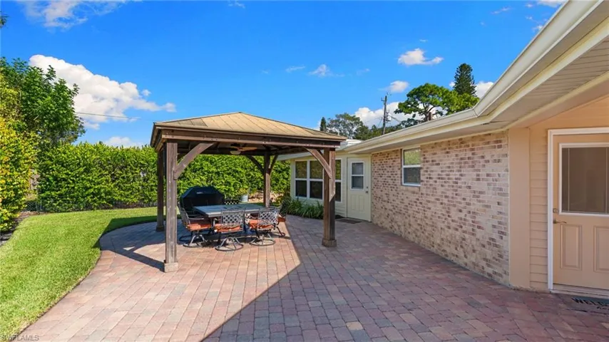 View of patio featuring a gazebo and outdoor dining area
