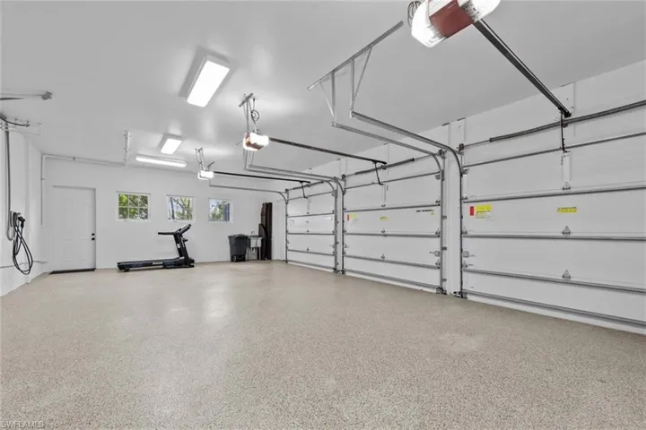 Garage featuring a garage door opener
