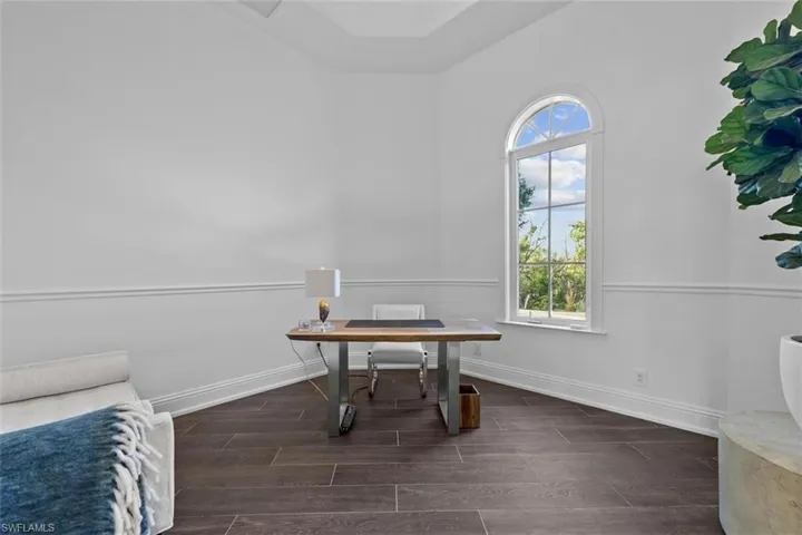 Office space featuring dark hardwood / wood-style flooring
