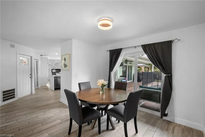 Dining space with light hardwood / wood-style floors