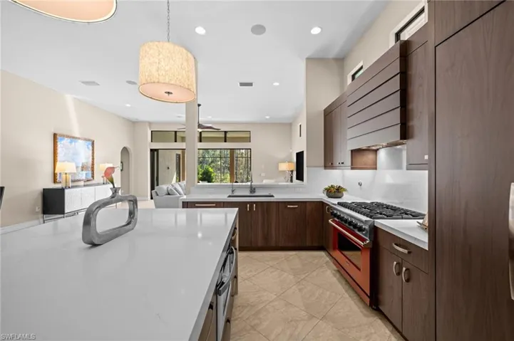 Clean lines, warm finishes, and elevated design come together in this elegant kitchen.