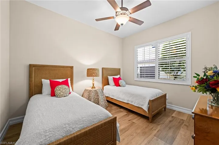 A stylish guest room with neutral tones and a relaxed coastal feel.