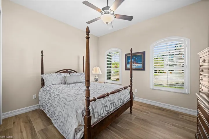 Charming and sunlit, this guest room offers comfort and privacy for visitors.