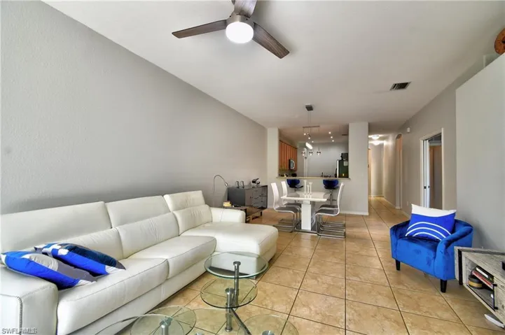 Tiled living room with ceiling fan