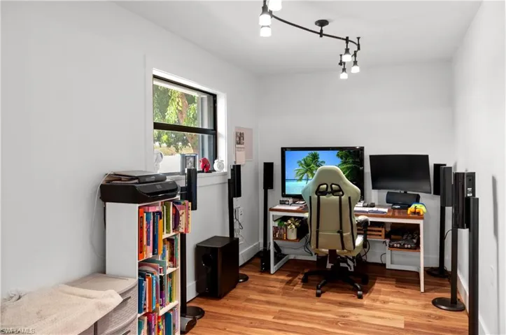 Office space featuring light wood-style floors and baseboards
