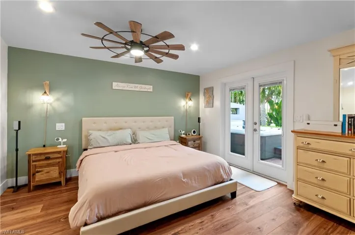 Bedroom with light wood-style flooring, access to outside, ceiling fan, french doors, and recessed lighting