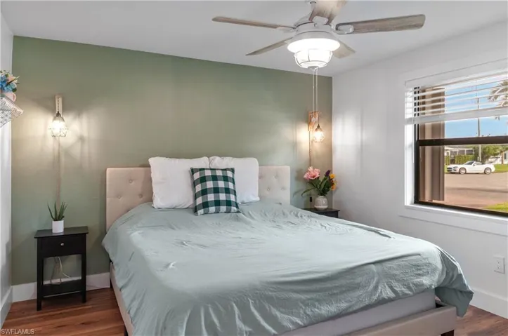 Bedroom featuring wood finished floors and a ceiling fan