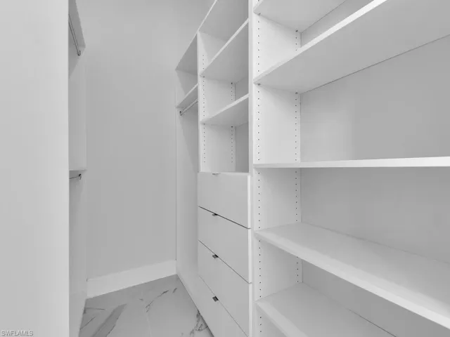 View of walk in California closet.