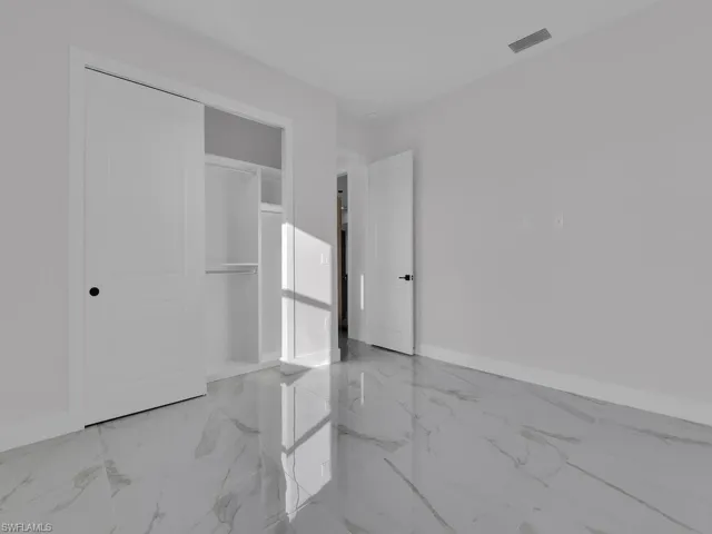 Unfurnished bedroom featuring a closet