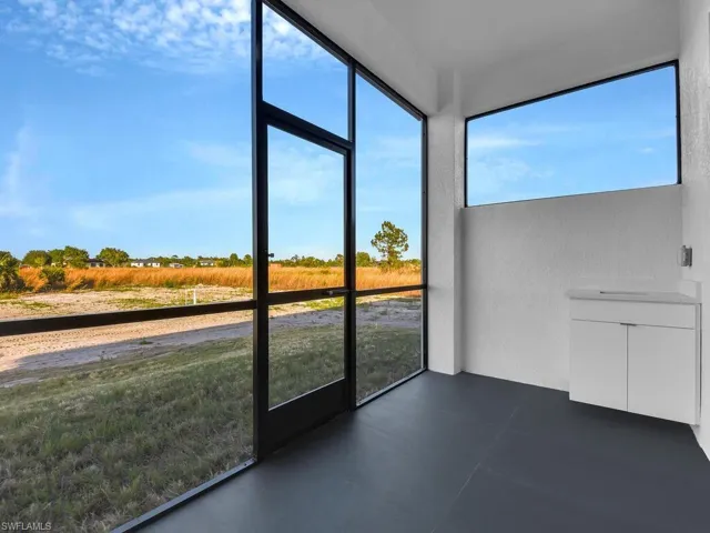 Unfurnished screened lanai  featuring a rural view and plenty of natural light