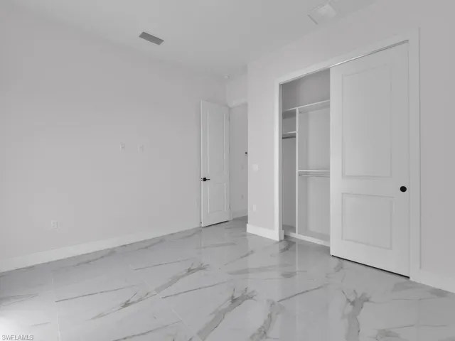 Unfurnished bedroom featuring a closet