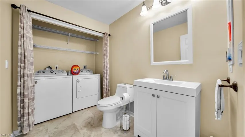 1/2 Guest Bathroom with washer and dryer