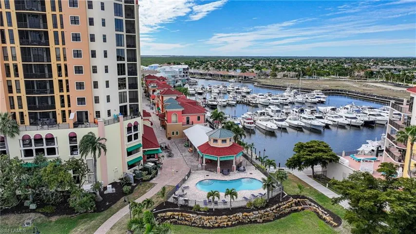 Bird's eye view of numerous boat docks and a large body of water