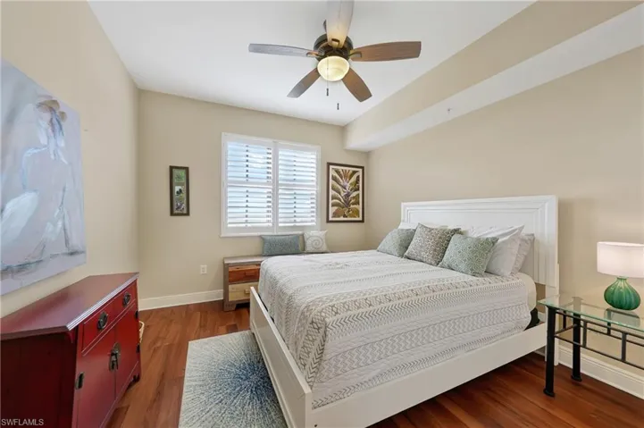 Bedroom featuring dark wood-style flooring and ceiling fan