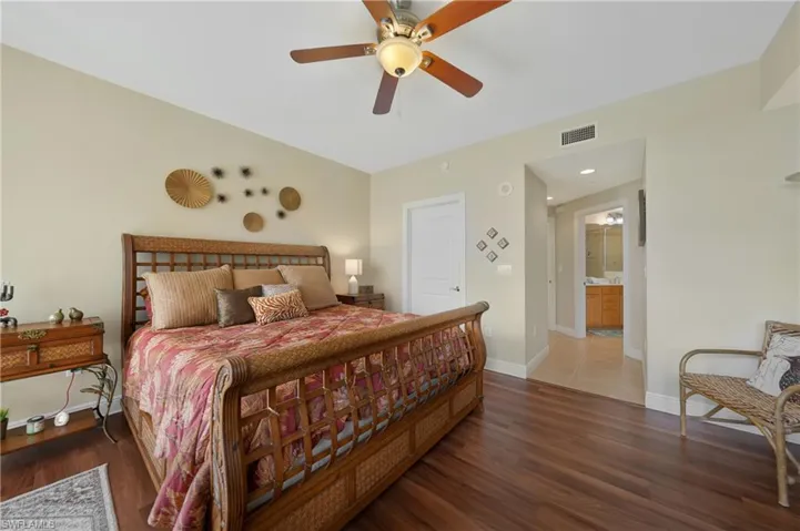 Bedroom featuring dark wood-style floors and ceiling fan