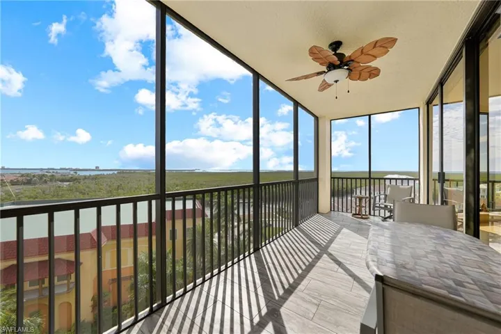 Sunroom featuring expansive windows
