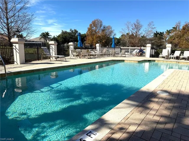 Community pool featuring a patio area