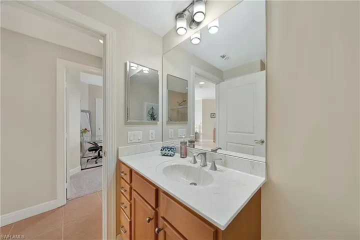 Bathroom featuring vanity and light tile patterned floors