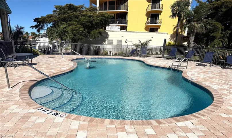 Smaller Community pool featuring a patio