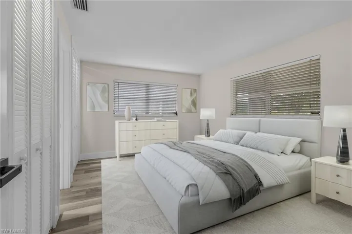 Bedroom with light hardwood / wood-style flooring