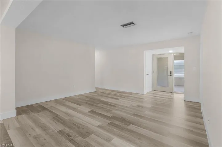 Spare room featuring light wood-type flooring