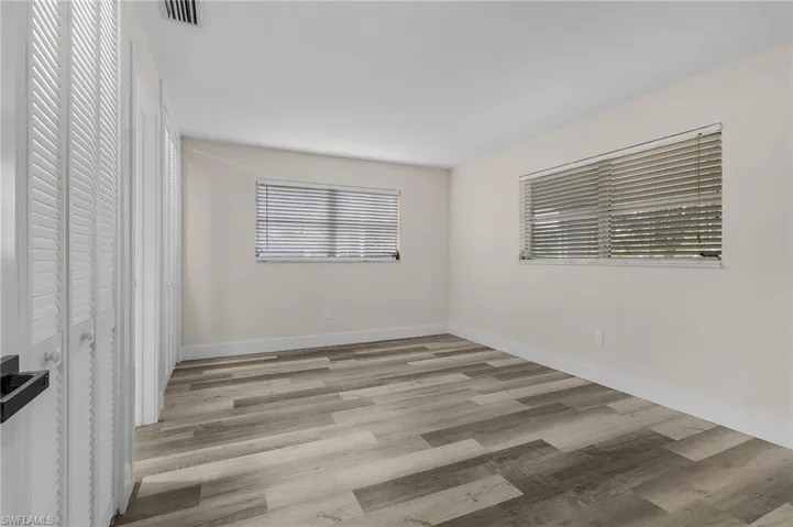 Empty room with light wood-type flooring