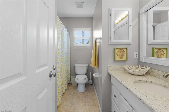 Guest bathroom has tub/shower combo