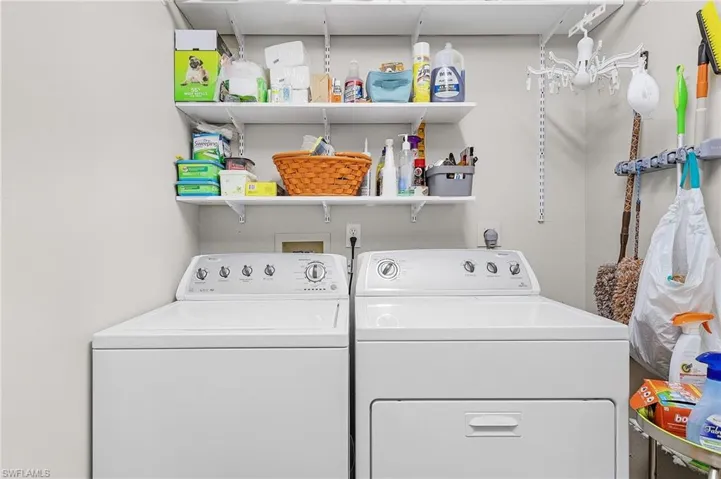 Laundry room with stainless steel tub sink