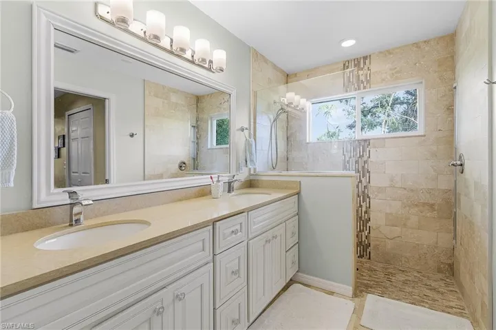 Primary bathroom with large walk-in tiled shower and separate w/c