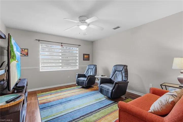 Den/TV room.  Could also be an office or 4th bedroom