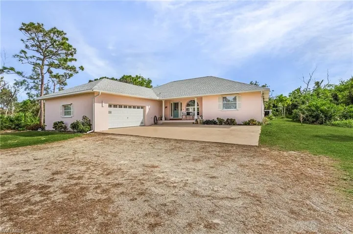 Front of home with two car garage.