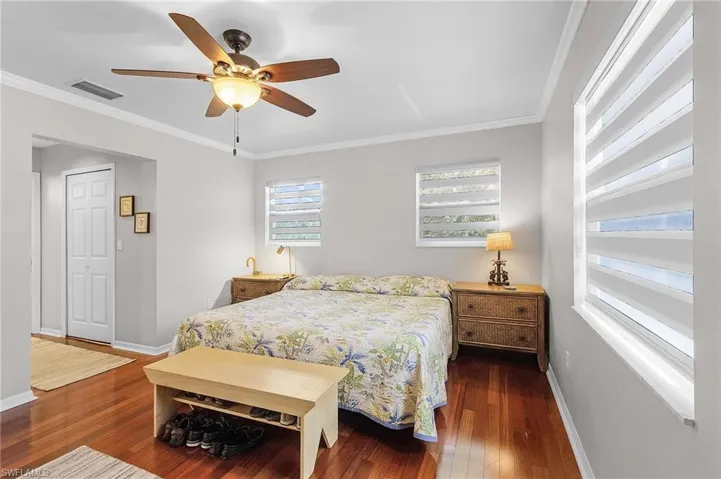 Primary bedroom with beautiful hardwood floors