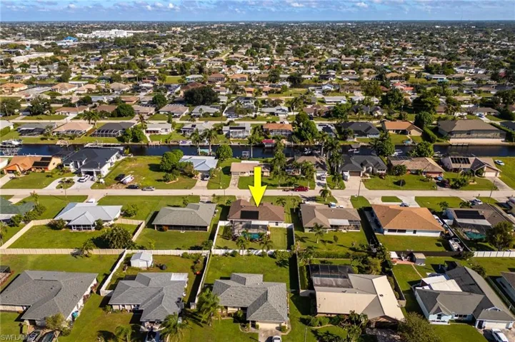View of property location with nearby suburban area and a nearby body of water