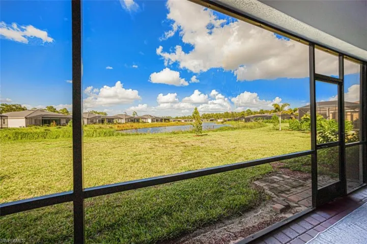 Unfurnished sunroom with a water view
