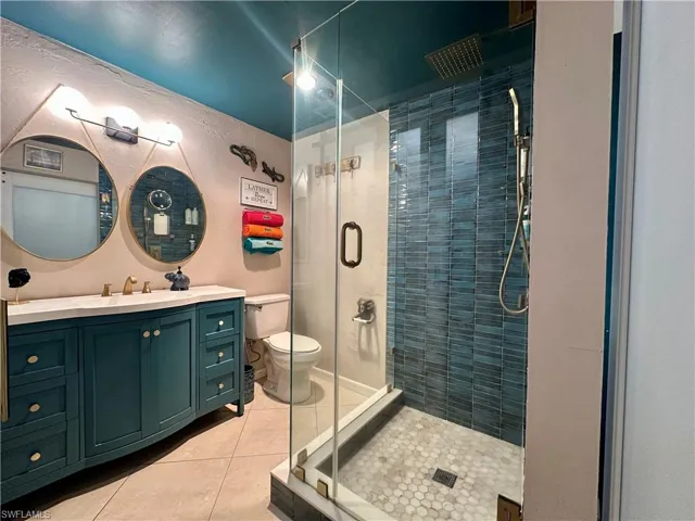Vanity with ample storage and a light-colored countertop