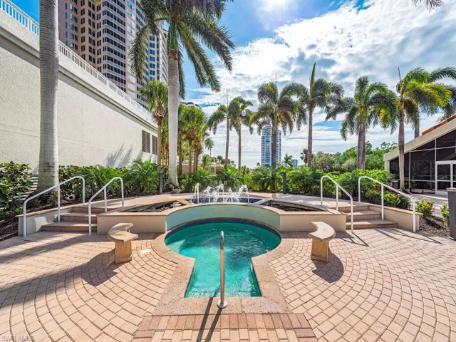 View of pool featuring a patio and a community hot tub