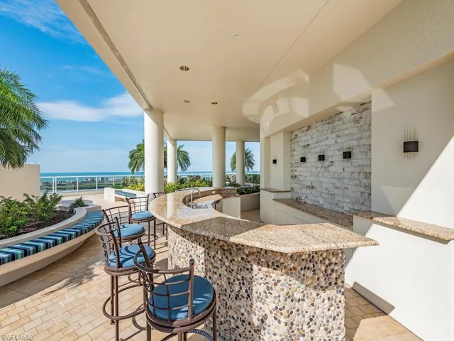 View of patio / terrace with a water view and exterior bar