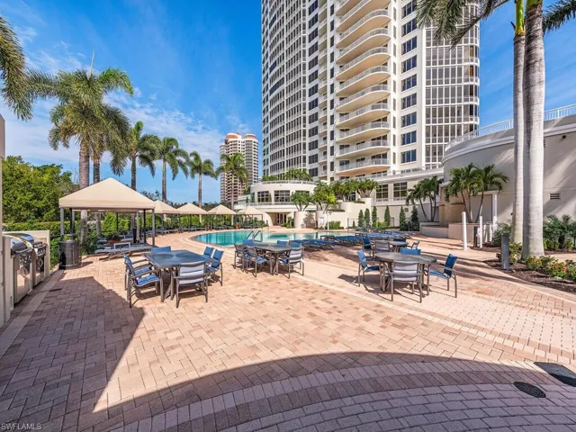 Community pool with a gazebo, a patio area, and outdoor dining area