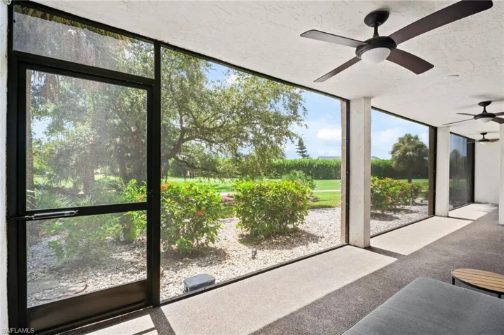 Sunroom / solarium with a ceiling fan
